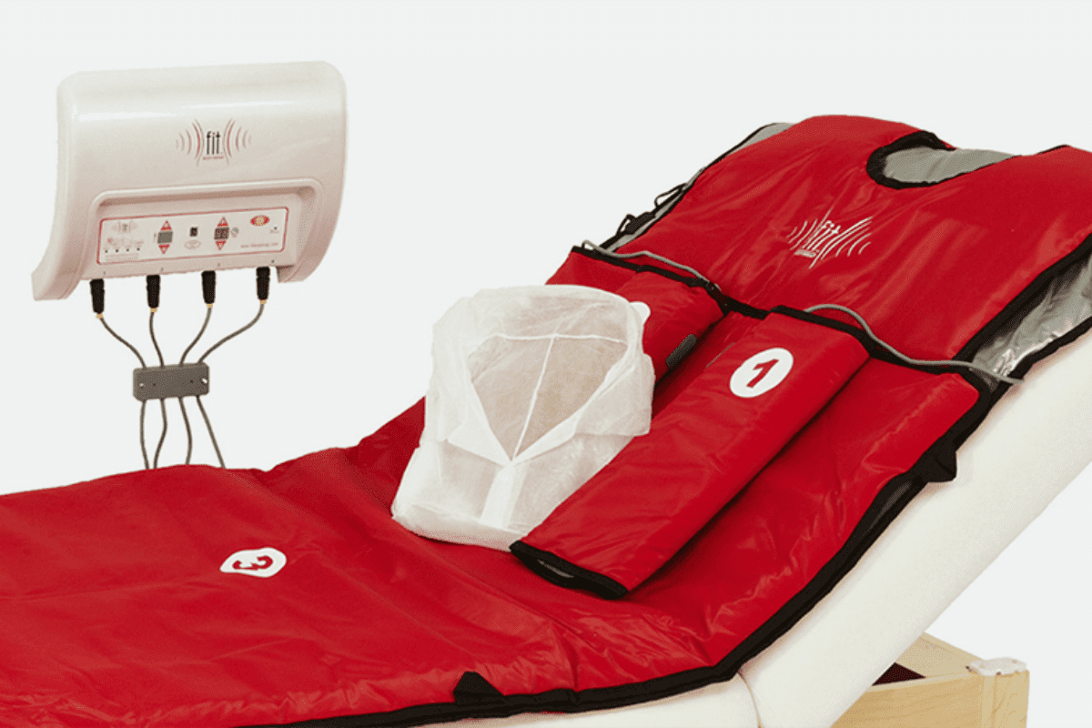Image of a FIT Bodywrap bed set up in a tranquil spa environment, ready for use.