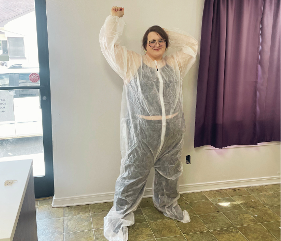 Client wearing a FIT Bodywrap protective suit at Heat and Wellness Spa in Ripley, MS before an infrared bodywrap treatment designed to support calorie burning, muscle recovery, stress relief, and overall wellness.