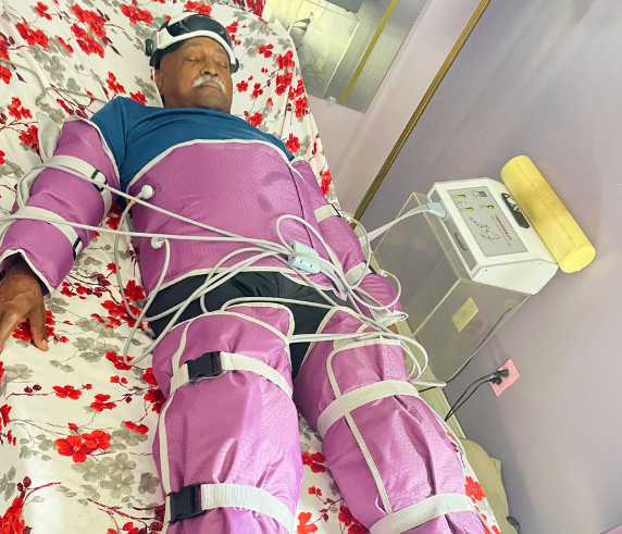 Client receiving a full-body pressotherapy treatment at Heat and Wellness Spa in Ripley, MS using compression therapy sleeves to improve circulation, support lymphatic drainage, reduce water retention, and promote relaxation and recovery.