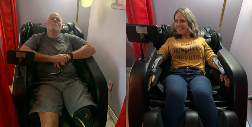 Two clients relaxing in therapeutic massage chairs at Heat and Wellness Spa in Ripley, MS, enjoying massage therapy to relieve muscle tension, reduce stress, and support relaxation and recovery.