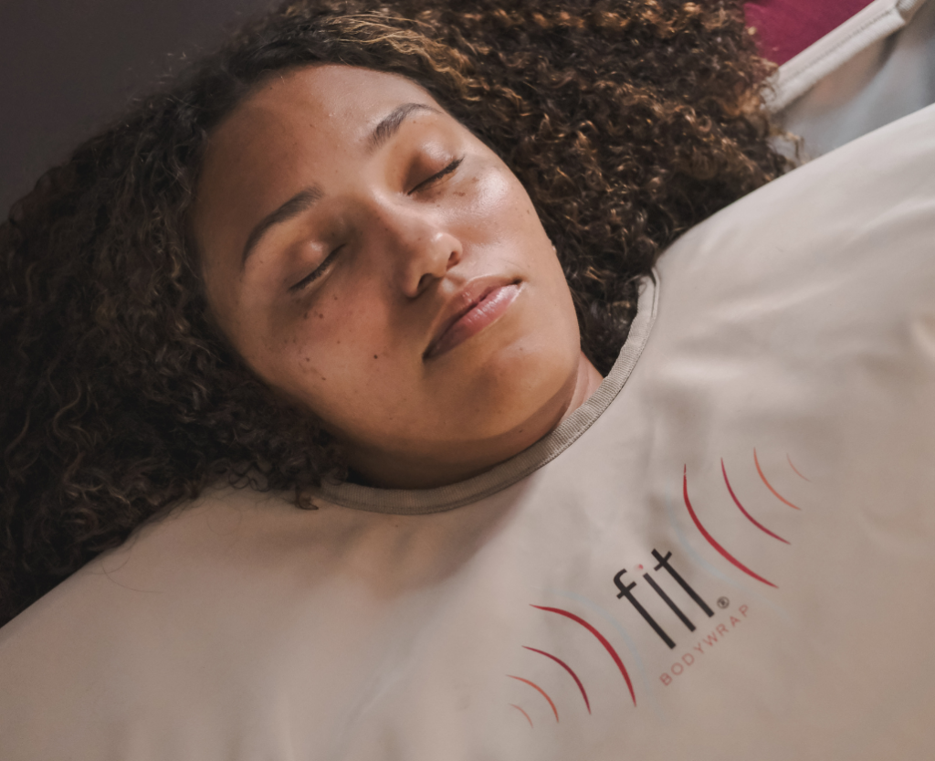 Client relaxing during a FIT Bodywrap infrared wellness treatment at Heat and Wellness Spa in Ripley, MS, supporting relaxation, recovery, and overall wellness.